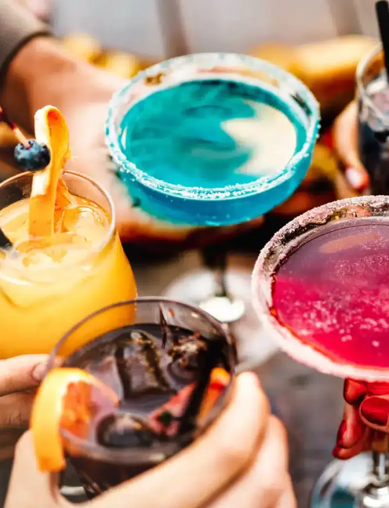 Four colorful mixed drinks